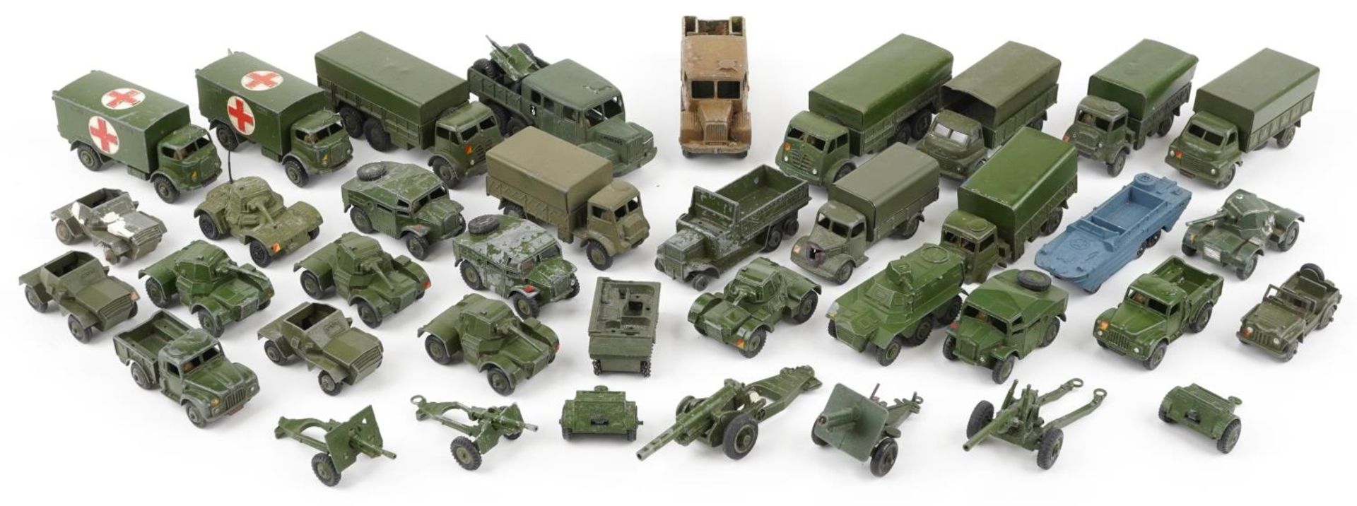 Vintage Dinky diecast army vehicles and weapons including three tonne army wagon, military ambulance