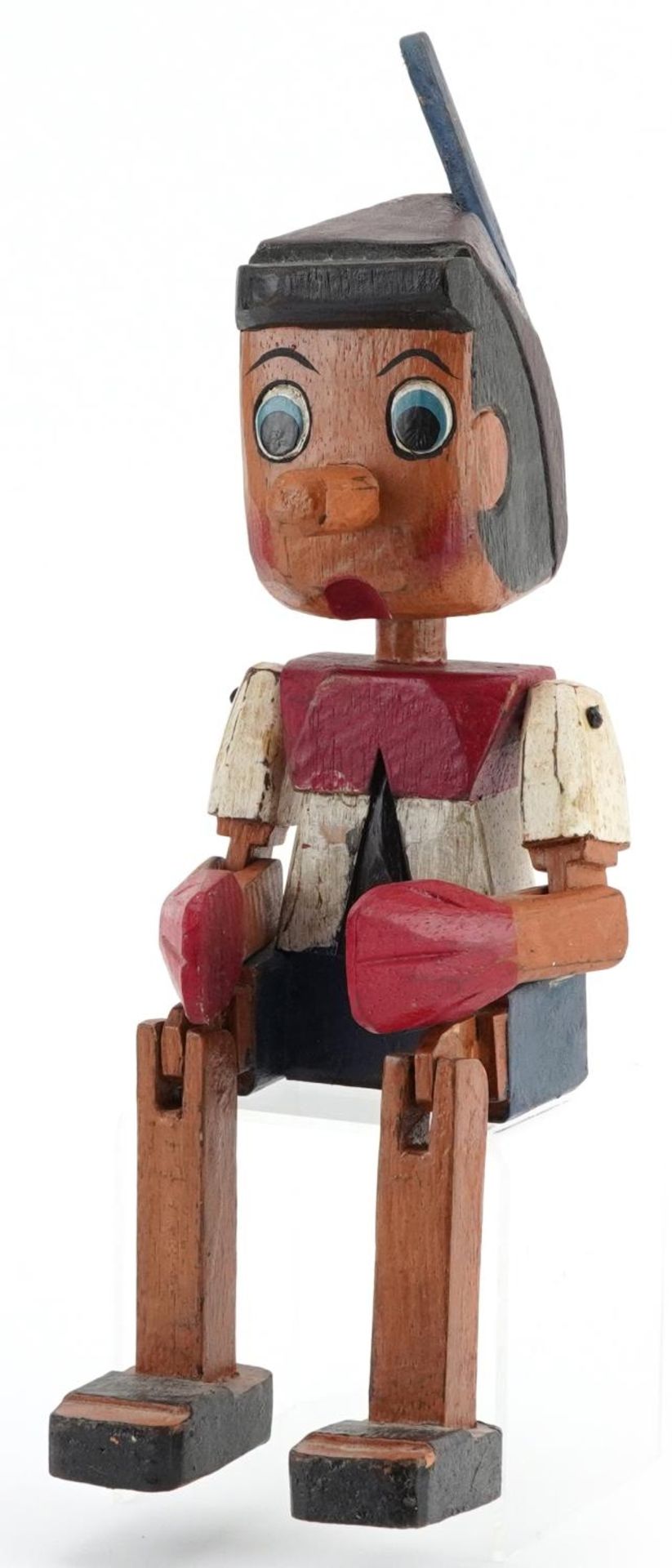 Hand painted carved wood figure of Pinocchio with jointed arms and legs, 35cm high