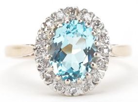9ct gold blue topaz and diamond cluster ring, the topaz approximately 9.0mm x 6.50mm x 4.70mm