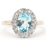 9ct gold blue topaz and diamond cluster ring, the topaz approximately 9.0mm x 6.50mm x 4.70mm