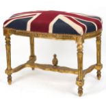 French style gilt stool with H stretcher on reeded legs with Union Jack design cushioned seat,