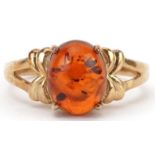 9ct gold cabochon natural amber ring with split bow design shoulders, size N, 3.3g