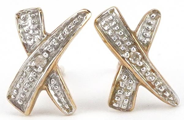 Pair of 9ct gold diamond cross stud earrings, each 1cm wide, total 0.6g