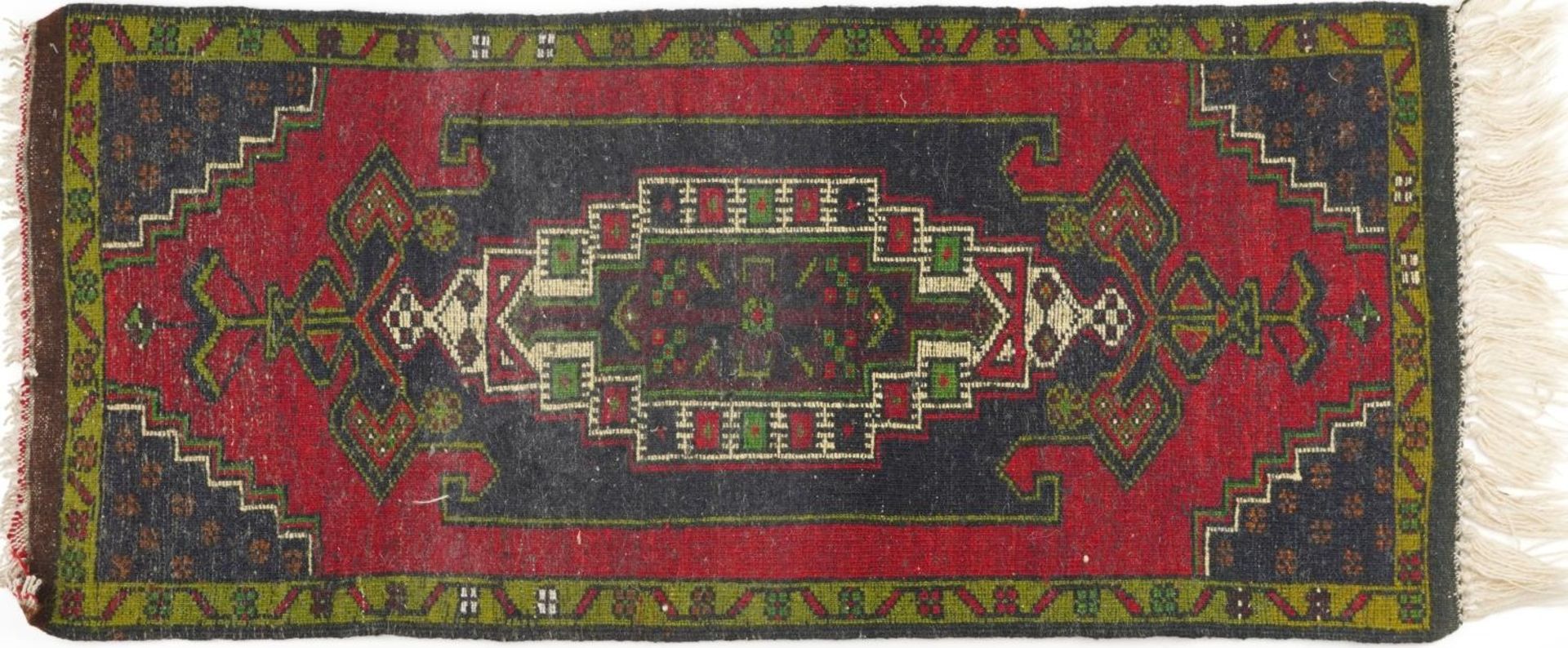 Rectangular Persian red and blue ground rug having an allover repeat floral design, 120cm x 53.5cm - Image 3 of 3