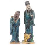 Pair of Chinese porcelain figures having sancai type glazes including one of an elder holding a