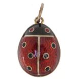 Silver gilt and guilloche enamel egg pendant in the form of a ladybird, impressed Russian marks to