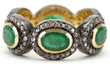 Unmarked yellow and white metal emerald and diamond ring, total emerald weight approximately 2.55