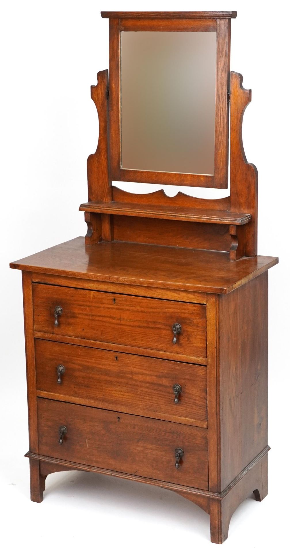 Arts & Crafts oak dressing chest with mirrored back and three drawers, 158.5cm H x 75.5cm W x 42.5cm