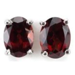 Pair of silver garnet stud earrings, each 8mm high, total 1.9g