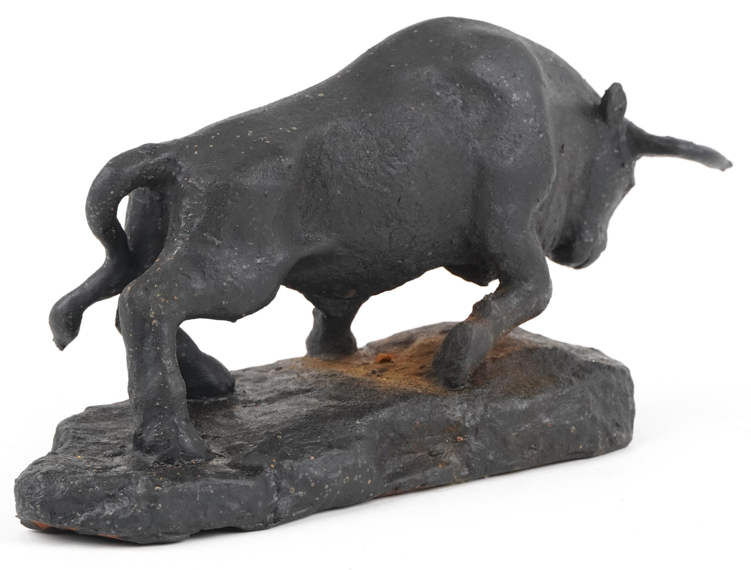 Black painted cast iron sculpture of a raging bull, 30.5cm in length - Image 2 of 3