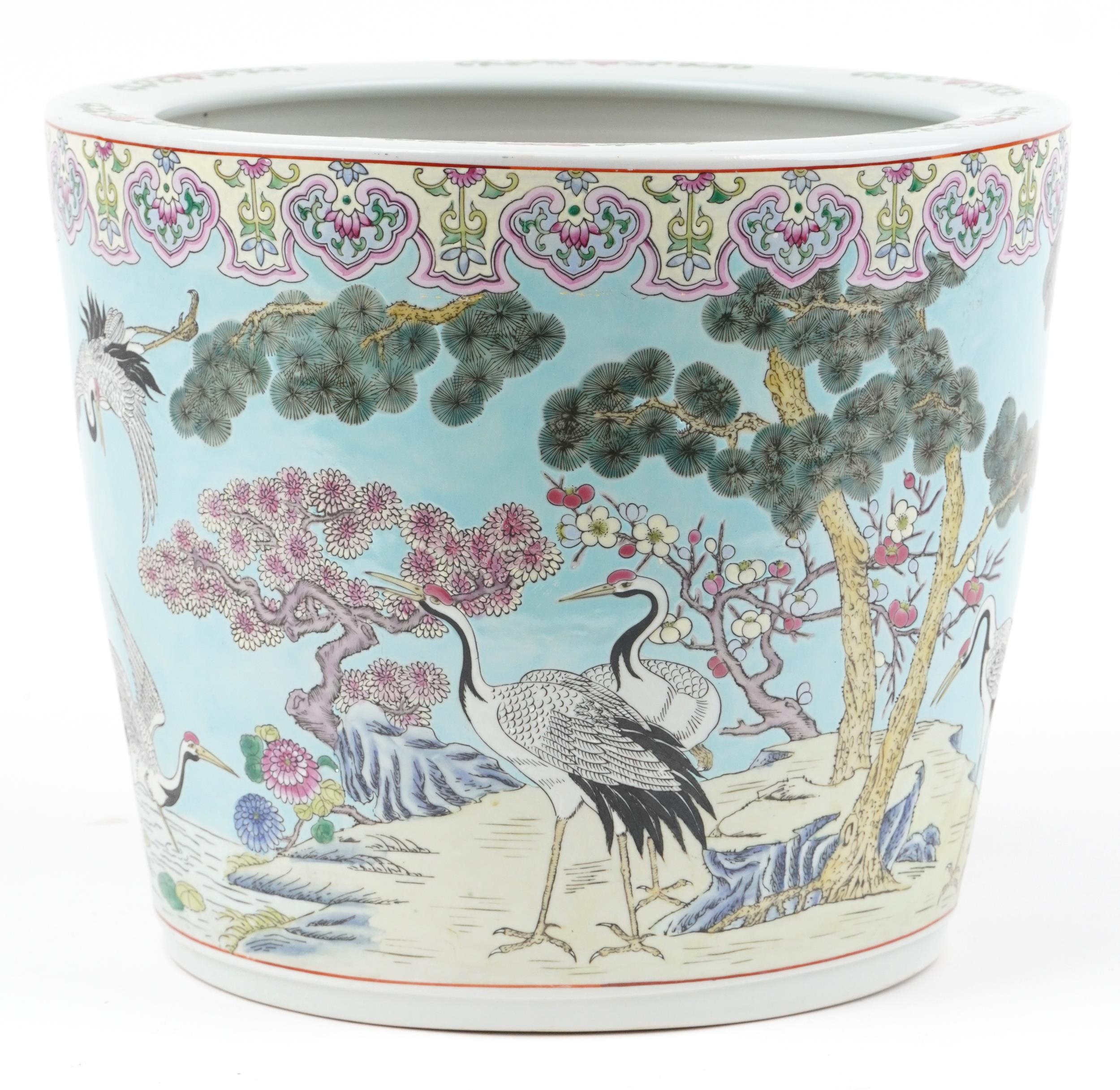 Large Chinese turquoise ground porcelain jardiniere hand painted in the famille rose palette with