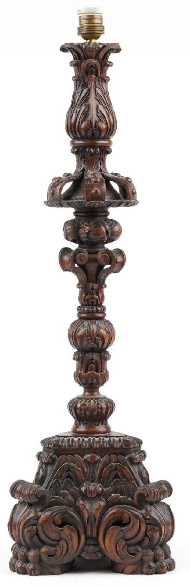 Large antique oak candle holder profusely carved with foliage, overall 76cm high