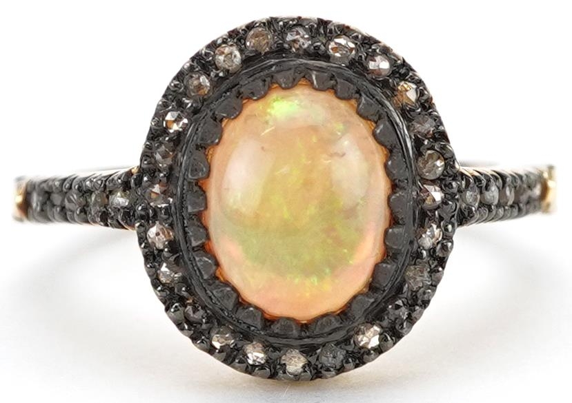 Silver gilt cabochon opal and diamond cluster ring with diamond set shoulders, total diamond