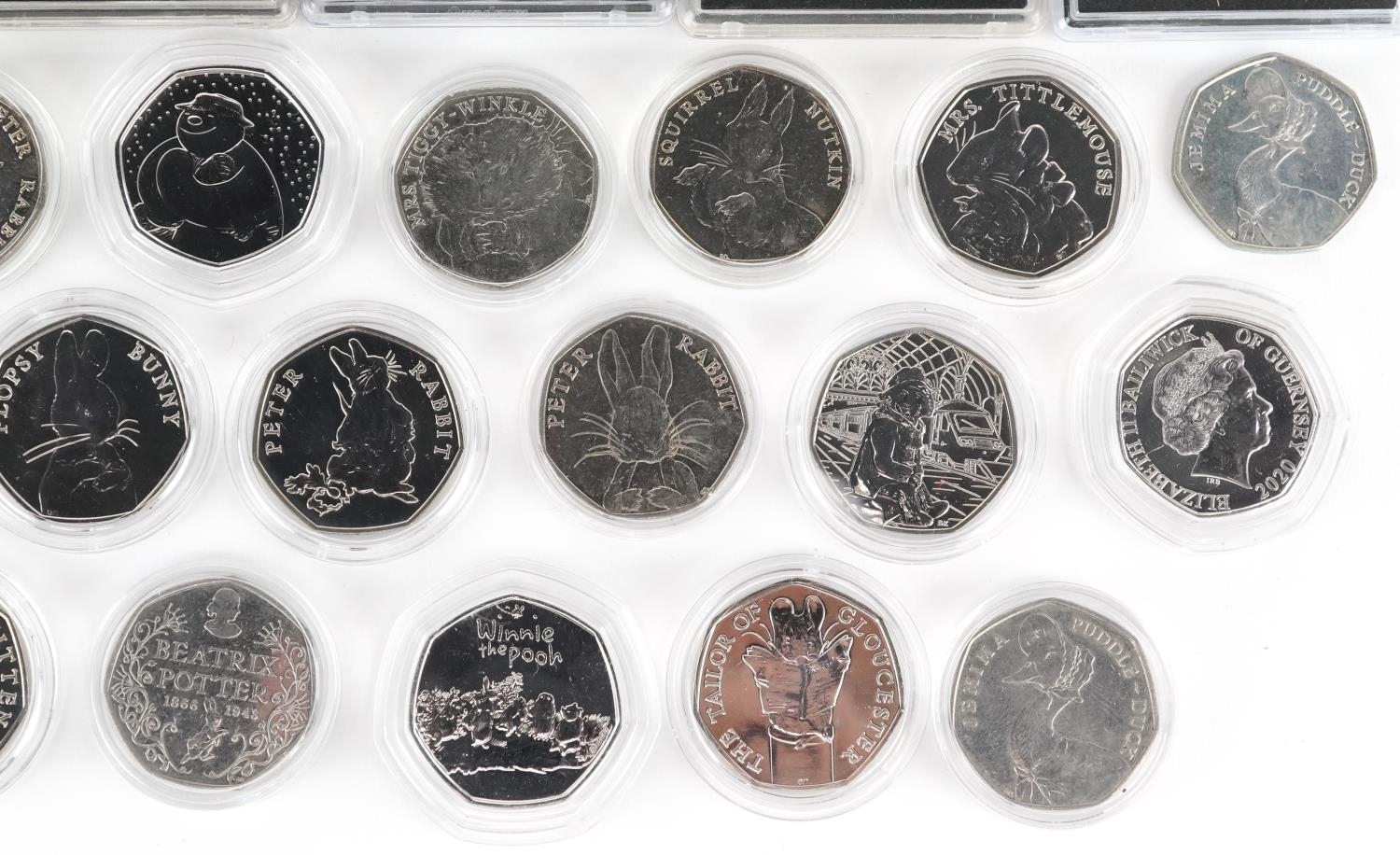 Thirty two Elizabeth II fifty pence pieces, various designs comprising Beatrix Potter, The Snowman - Image 5 of 5