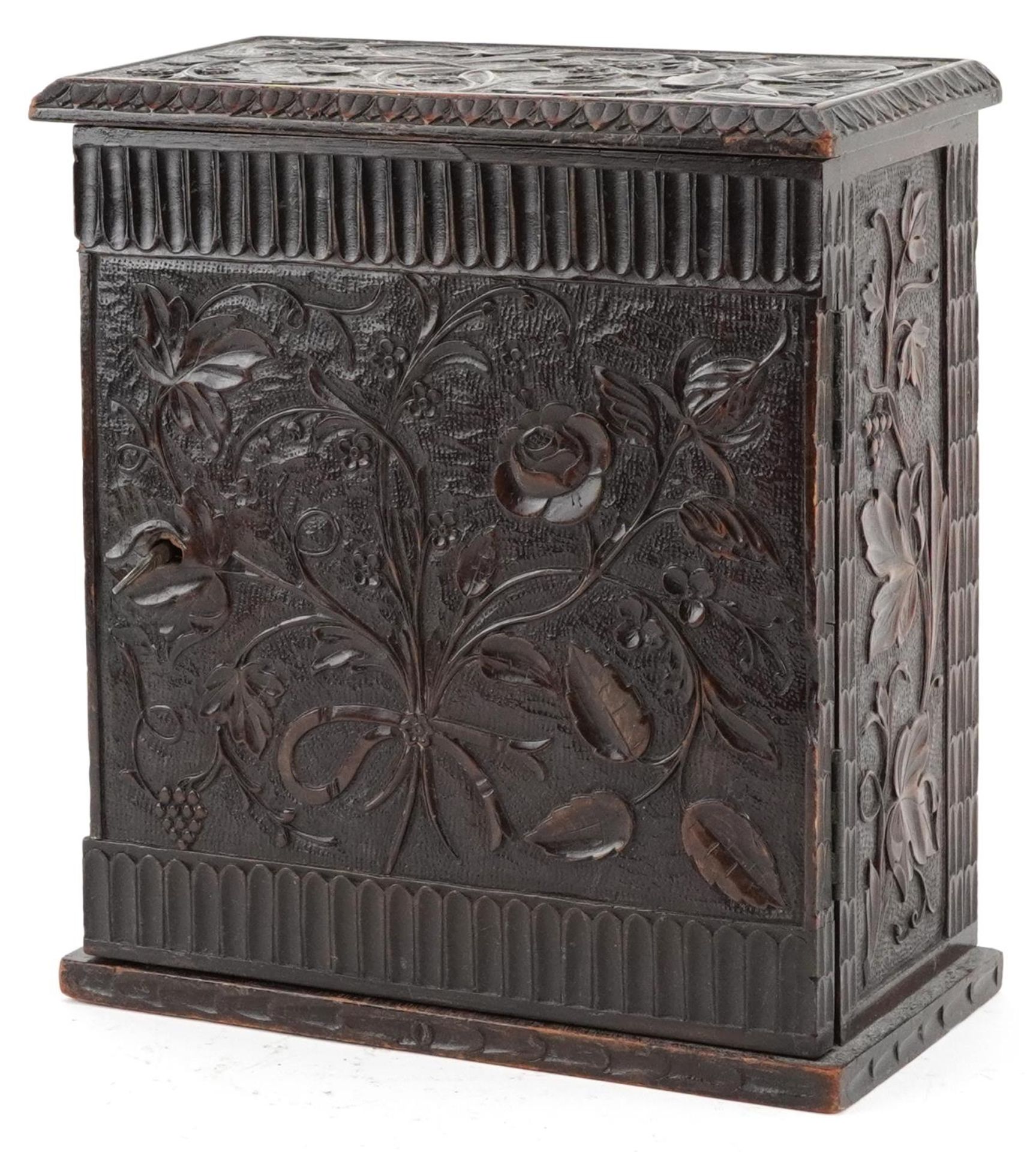 19th century oak table top collector's chest finely and profusely carved with foliage having