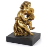 19th century gilt bronze statuette of a nude musician playing the cymbals, raised on a rectangular