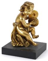 19th century gilt bronze statuette of a nude musician playing the cymbals, raised on a rectangular