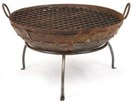 Cast metal firepit with twin handles and grill on tripod stand, 50cm high x 90.5cm in diameter