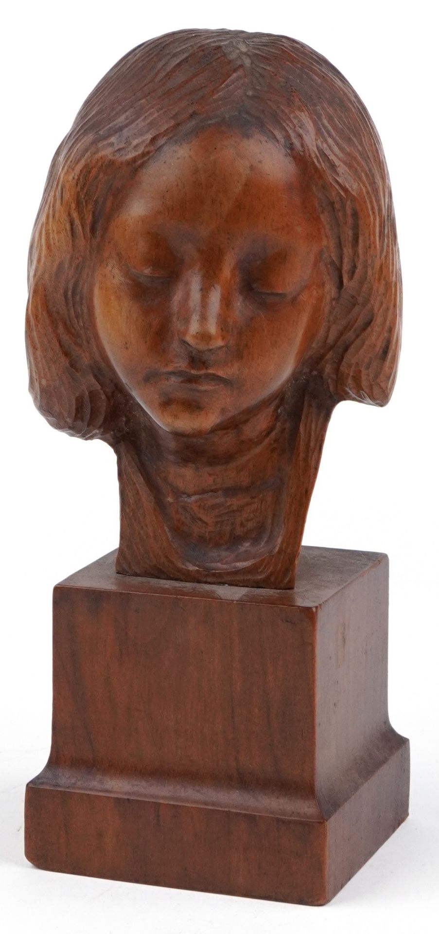 Continental carved fruitwood bust of a young female raised on a square block base, indistinctly