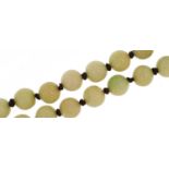 Chinese green jade bead necklace, 124cm in length, 150.7g