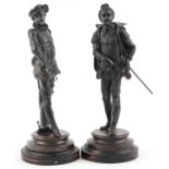 Pair of Victorian patinated spelter figures in 17th century dress raised on circular ebonised wooden