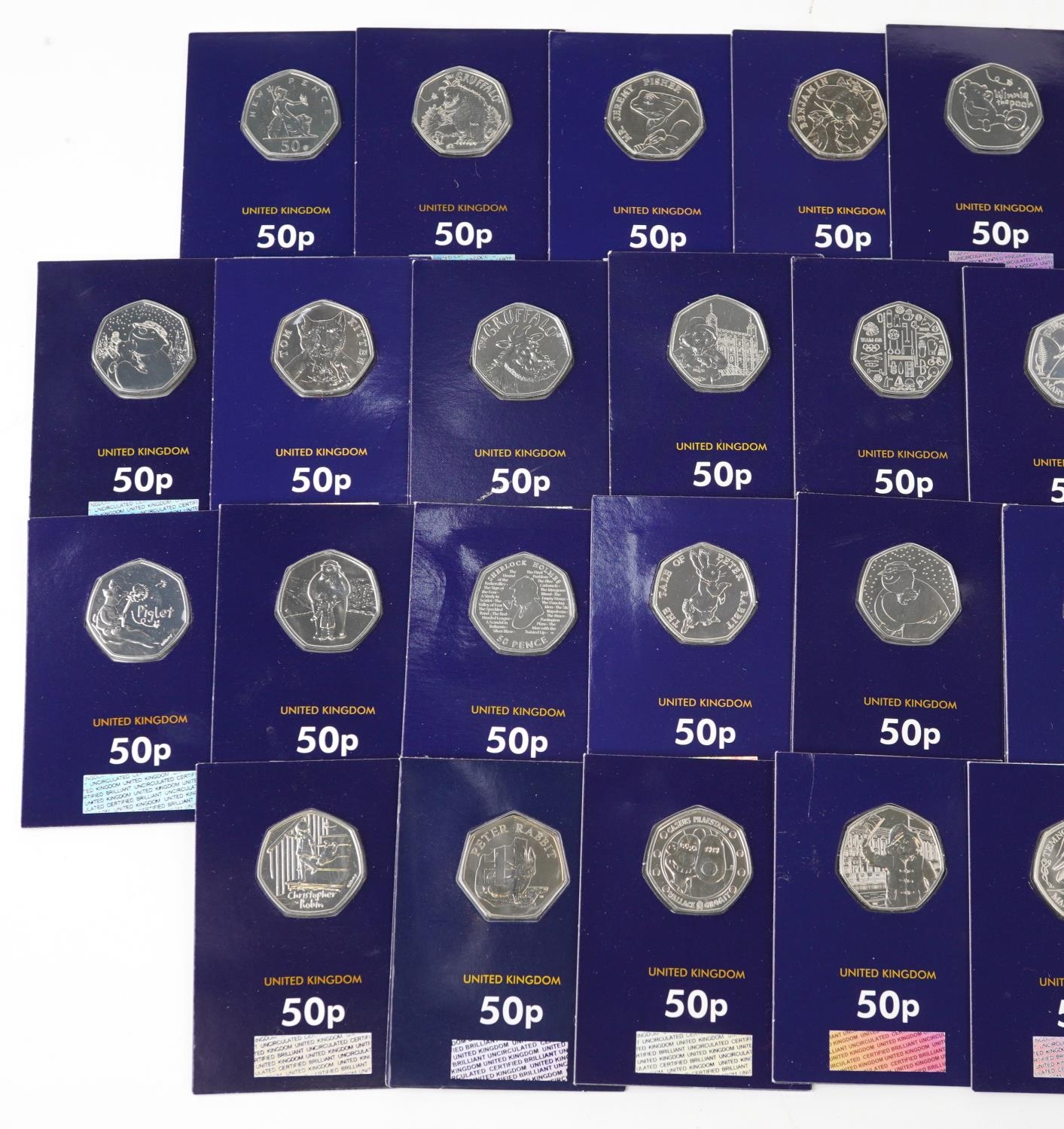 Thirty three Elizabeth II fifty pence pieces housed in Change Checker sleeves, various designs - Image 2 of 3