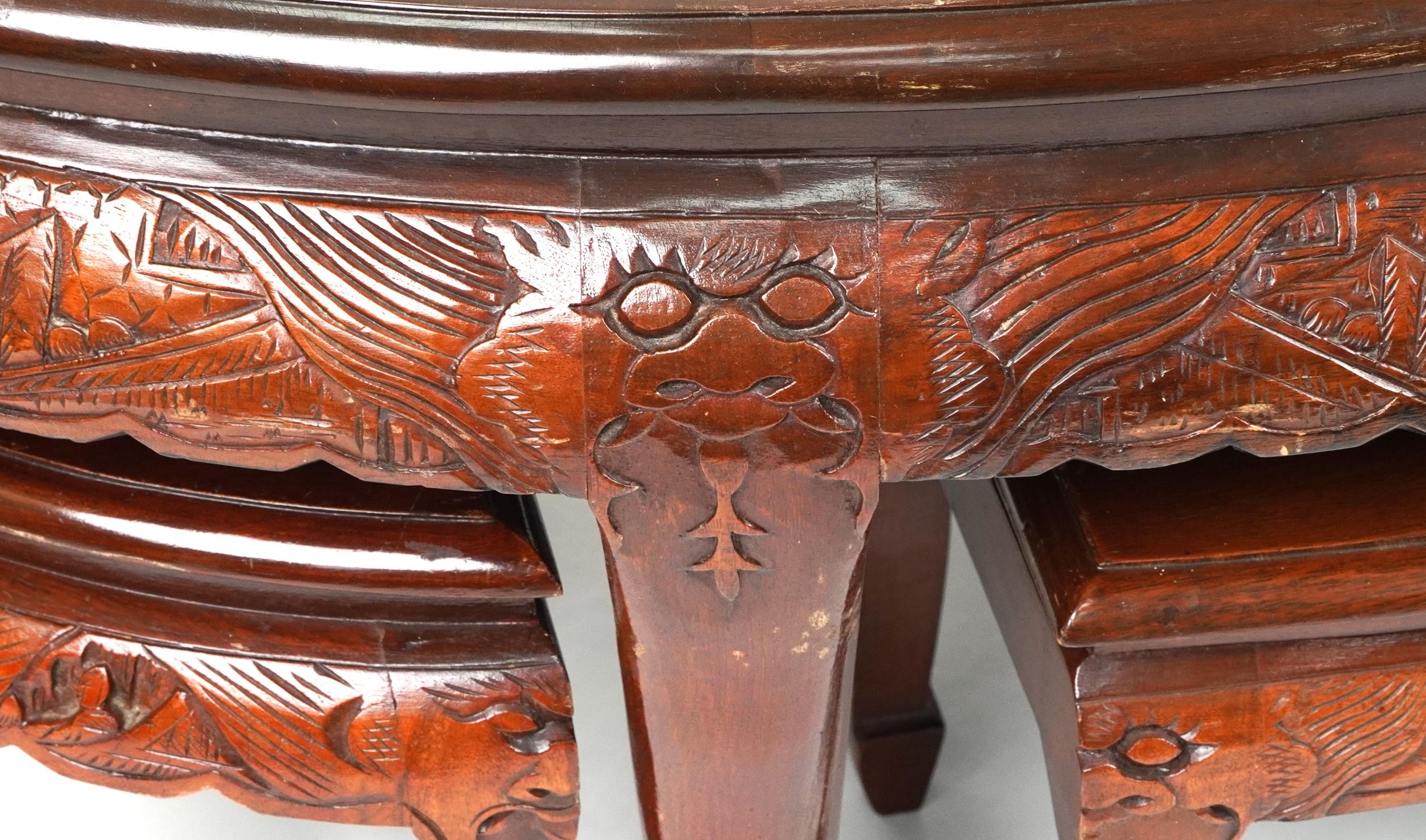 Nest of seven Chinese camphor wood occasional tables comprising an oval coffee table housing six - Image 3 of 9