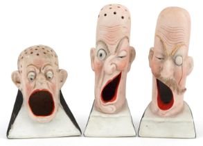 Schafer & Vater, three smoking interest early 20th century German bisque smoking head ashtrays,