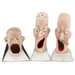 Schafer & Vater, three smoking interest early 20th century German bisque smoking head ashtrays,