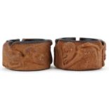 Matched pair of smoking interest Meerschaum ashtrays decorated in relief with figures, each 10cm