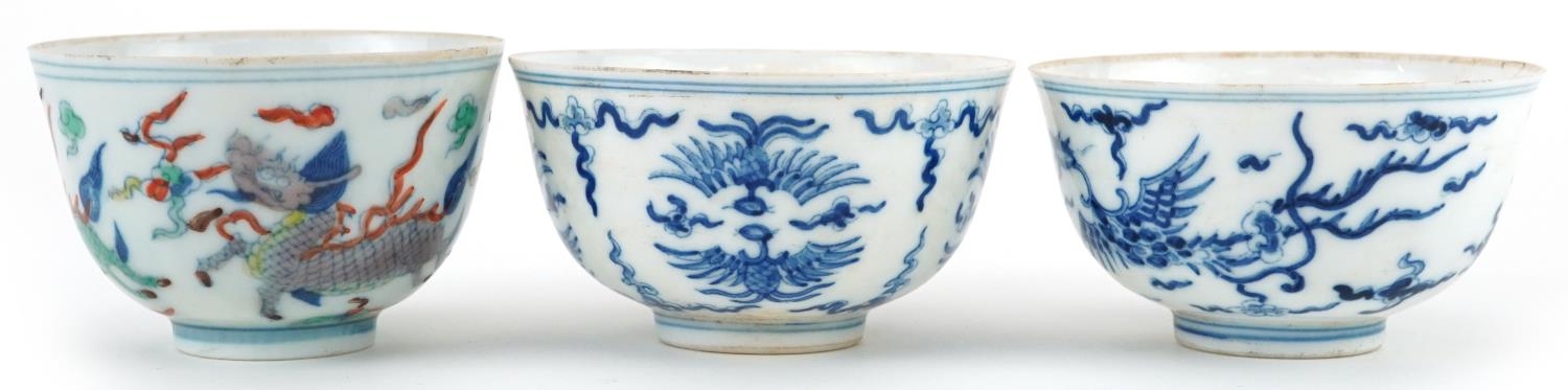 Three Chinese porcelain bowls including a blue and white example hand painted with stylised - Image 3 of 9