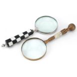 Two magnifying glasses including an example with chequered design handle, the largest 26cm in length
