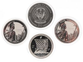Four one ounce silver proof coins including two Britannia crowns and Republic of Rwanda example