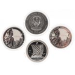 Four one ounce silver proof coins including two Britannia crowns and Republic of Rwanda example