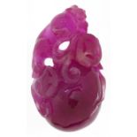 Chinese pink tourmaline pendant carved with a water dragon and fruit, 6.5cm high