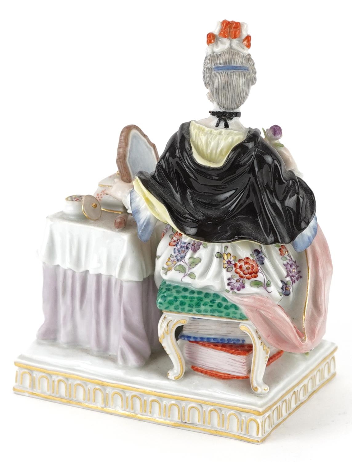 Meissen, 19th century German porcelain figure of a female sitting beside a dressing table with - Image 2 of 3