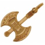 High carat gold charm in the form of a Viking axe, tests as 18ct+ gold, indistinct mark to the