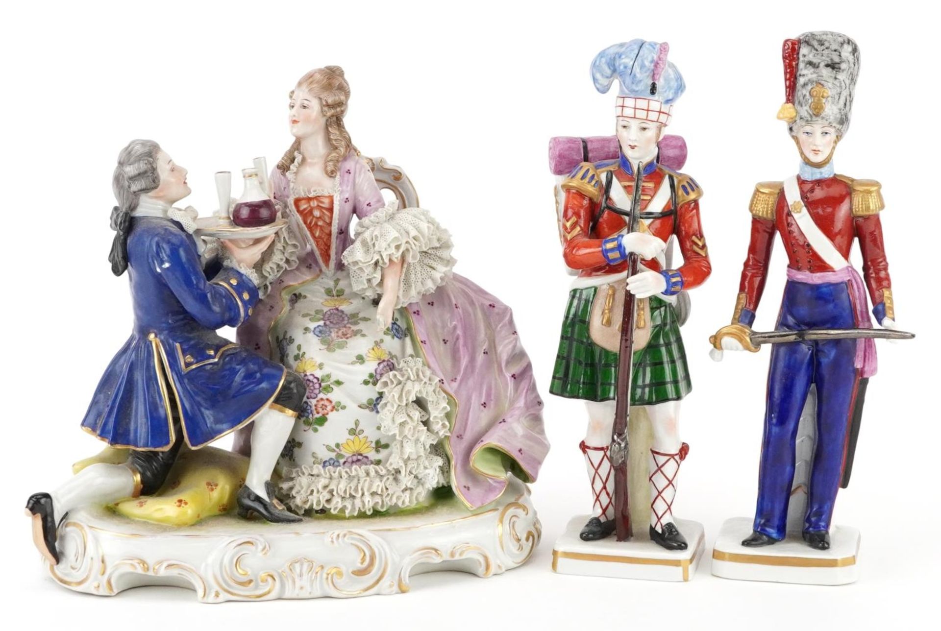 Continental porcelain comprising a Neapolitan lace figure group of a female and waiter and two