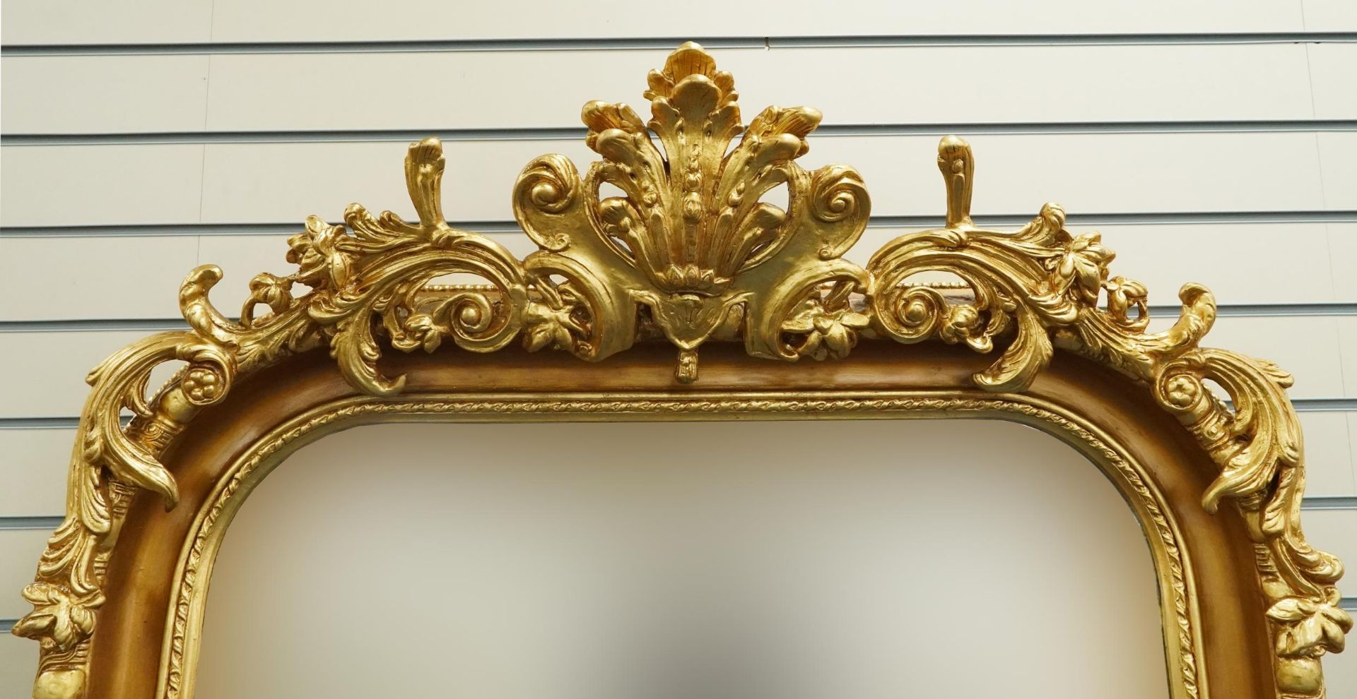 Large ornate gilt framed wall mirror having bevelled glass mounted with flowers and foliage, 220cm x - Image 2 of 4