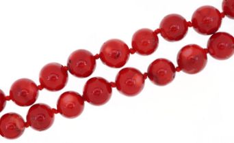 Red coral bead necklace, each bead approximately 15mm in diameter, overall 50cm in length, 130.5g