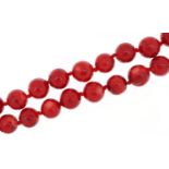 Red coral bead necklace, each bead approximately 15mm in diameter, overall 50cm in length, 130.5g