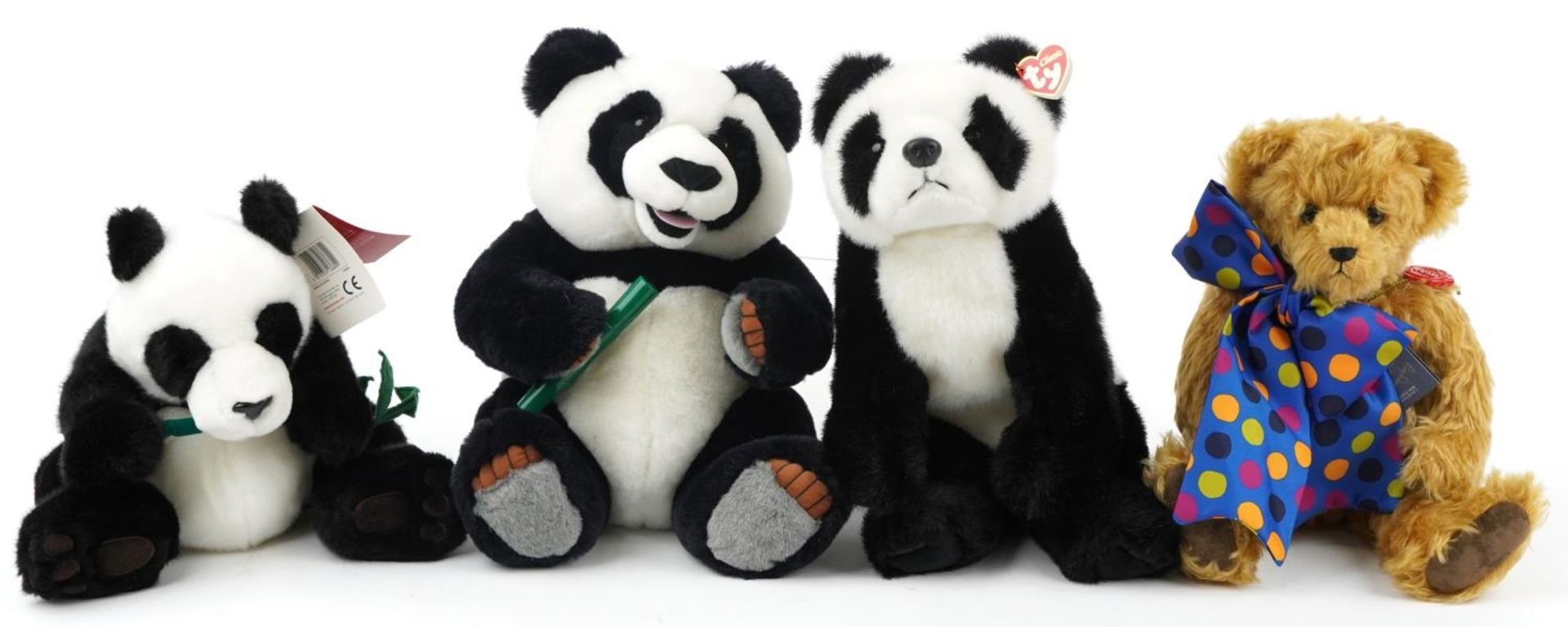 Hermann teddy bear with jointed limbs and three soft toy pandas, 42cm high