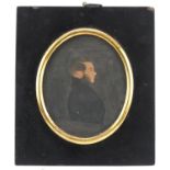 Georgian oval silhouette portrait of a young gentleman housed in an ebonised frame, indistinctly