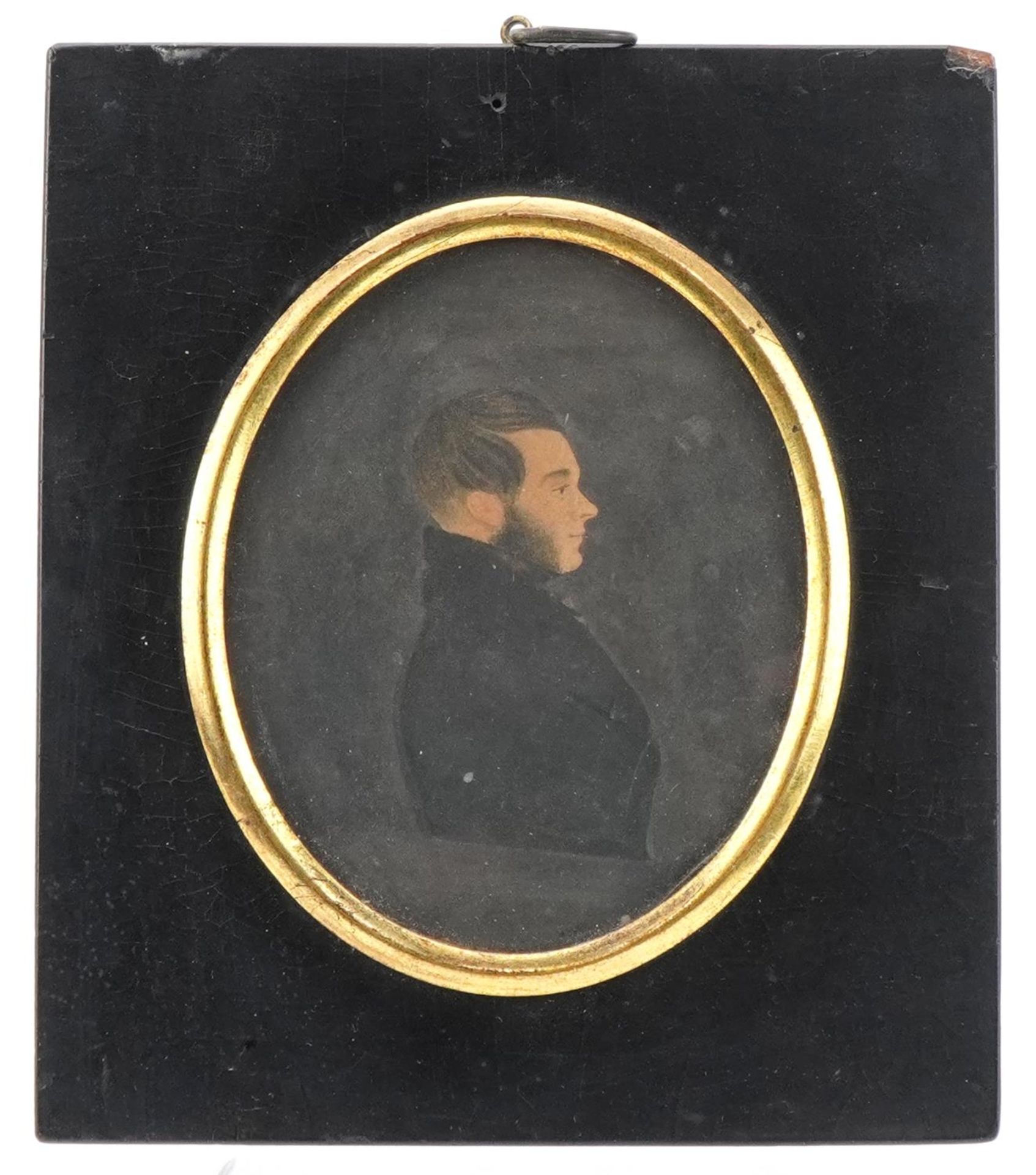 Georgian oval silhouette portrait of a young gentleman housed in an ebonised frame, indistinctly