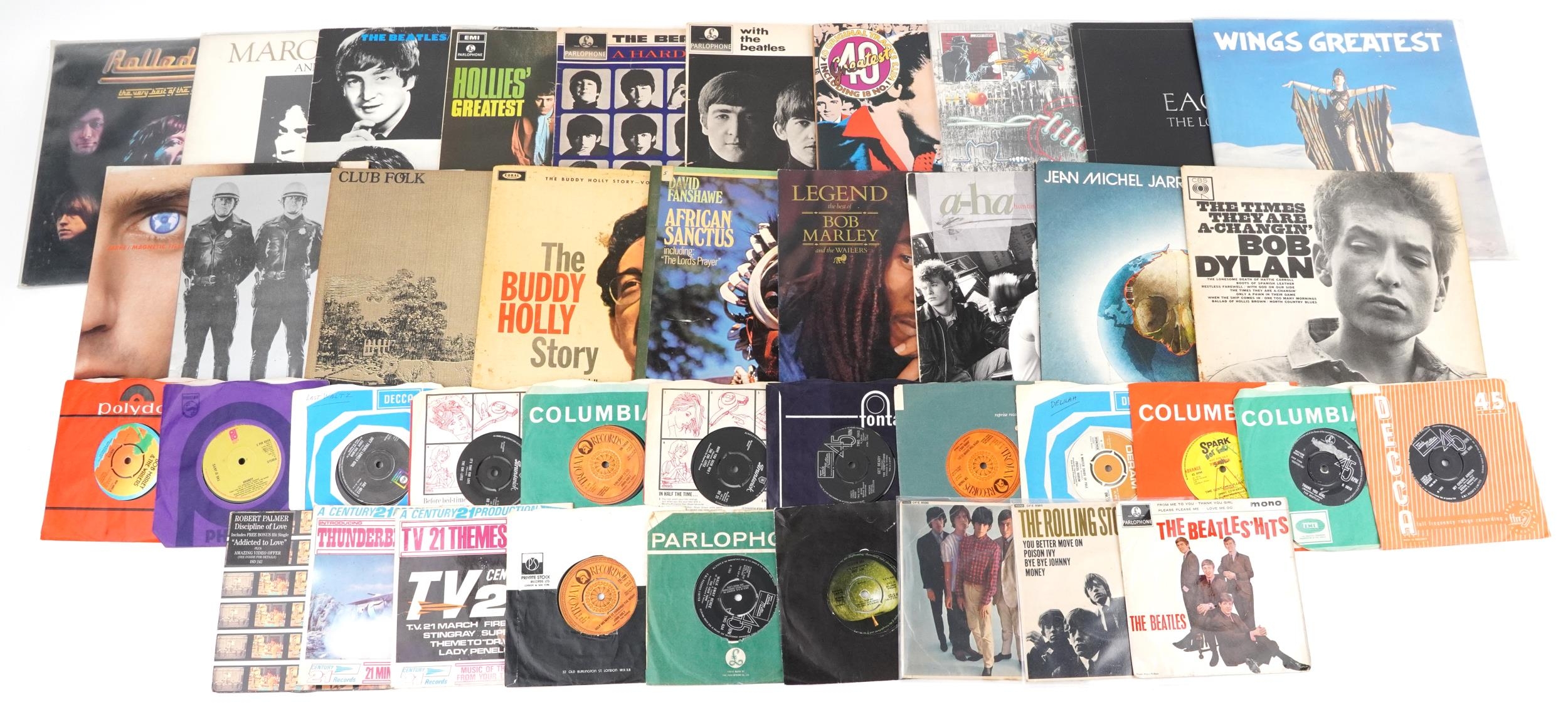 Vinyl LP records and 45rpms including Marc Bolan & T Rex, The Beatles, The Eagles, Wings, Bob