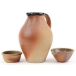 John Leach, Muchelney studio pottery including a large jug having a brown glaze, the largest 30cm