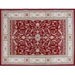 Rectangular red and cream ground floral rug, 230cm x 160cm