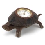 Victorian iron desk clock in the form of a turtle with enamelled dial having Arabic numerals, 17cm