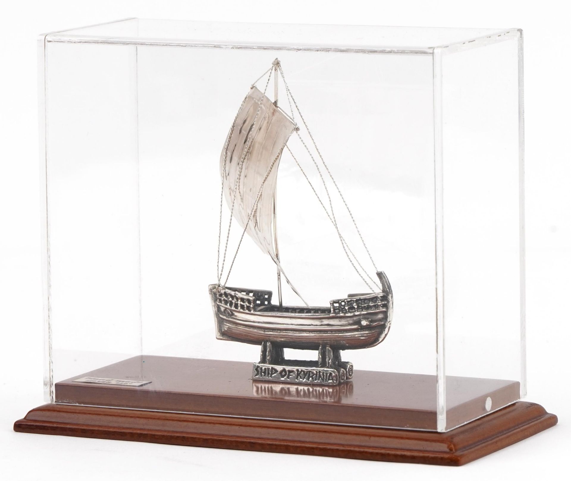 950 grade silver model of The Ship of Kyrenia housed in a display case, overall 14.5cm high,