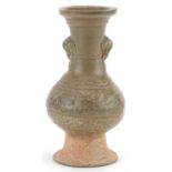 Chinese porcelain vase with ring turned elephant head handles having a celadon glaze, 16.5cm high